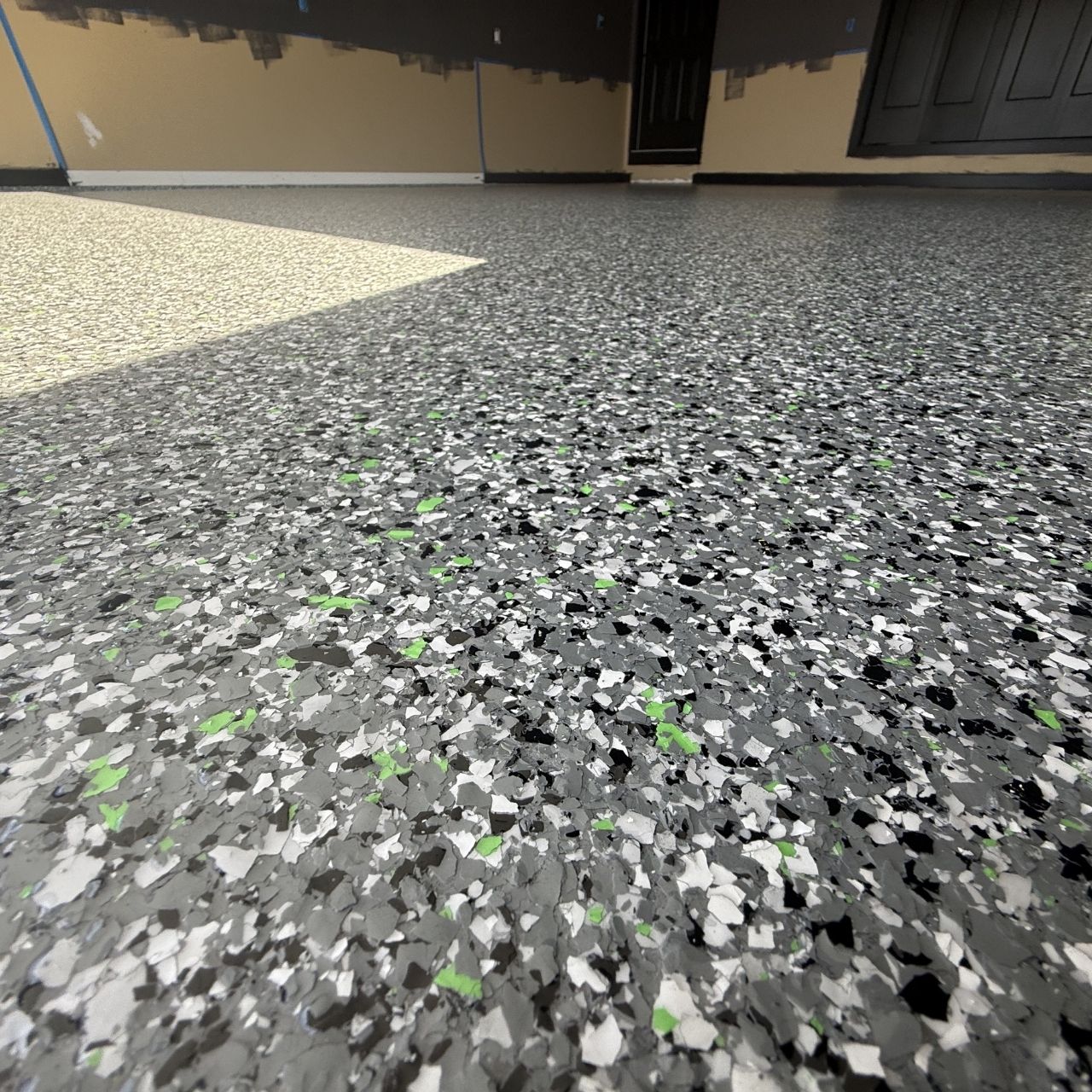 Green accent flake garage floor closeup Missouri