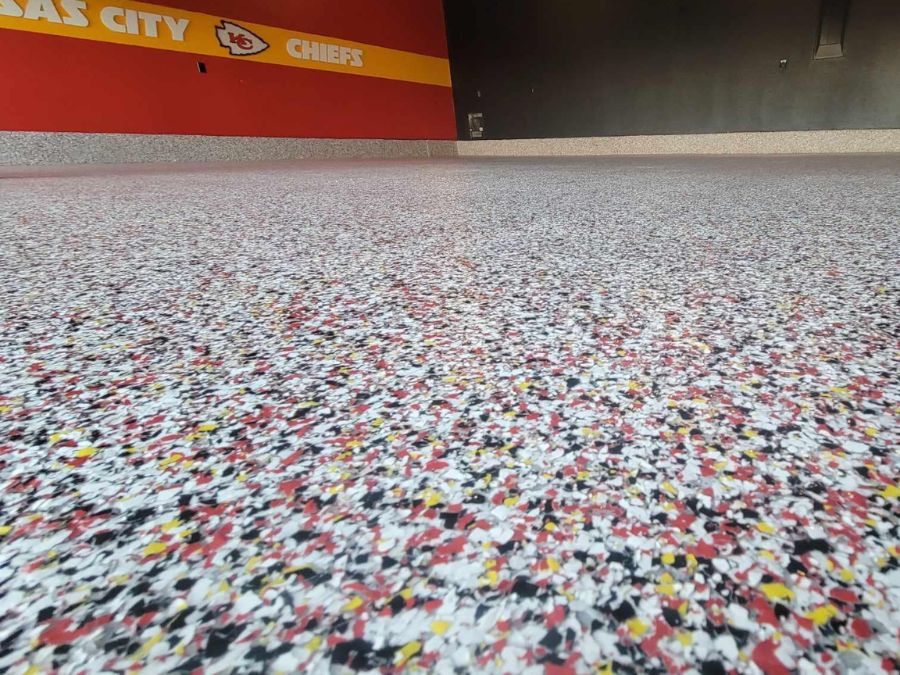 Custom KC Chiefs themed garage floor coating Springfield Missouri — red yellow flake polyaspartic