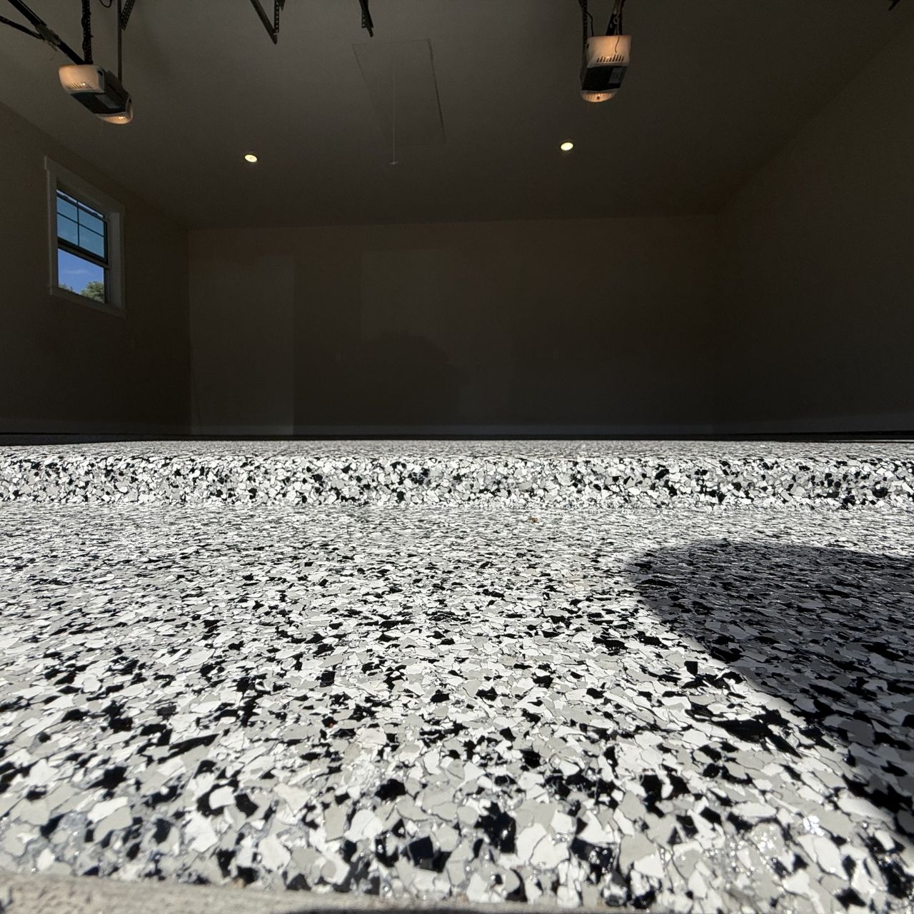 Shop floor flake coating closeup Southwest Missouri